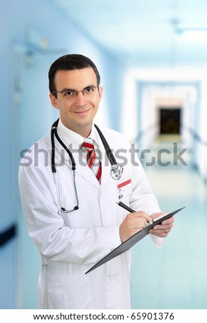 Portrait of friendly medical doctor medical pad.