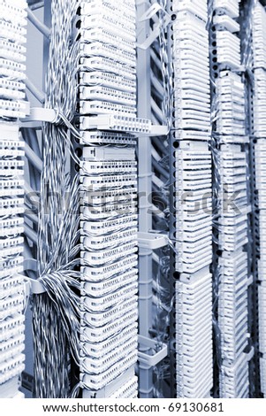 Telecommunication equipment of network cables in a datacenter.