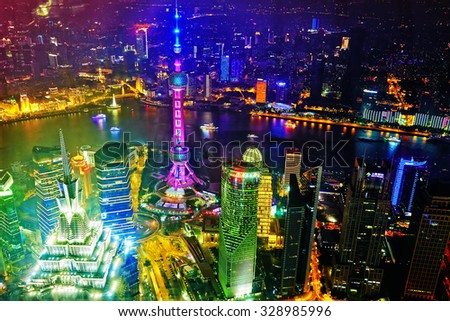 SHANGHAI, CHINA -MAY 24, 2015. Oriental Pearl Tower at the nighttime. Tower  470 meter the Oriental Pearl is one of Shanghai\'s tallest buildings, located at Lujiazui finance and trade zone .