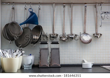 Some utensil on the kitchen wall
