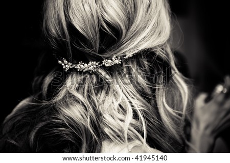 Bride\'s hair, styled with a hair ornament.