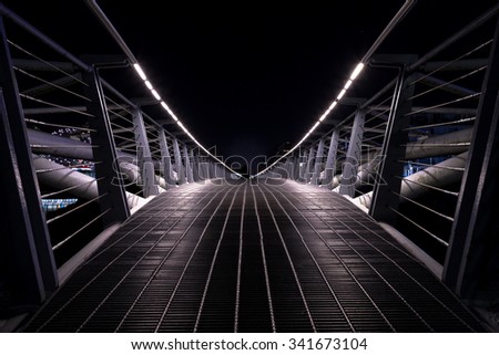 Small pedestrian bridge at night in False Creek, Vancouver.