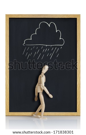 Manikin, anatomical model, placed on a chalkboard with a cloud drawn on it.
