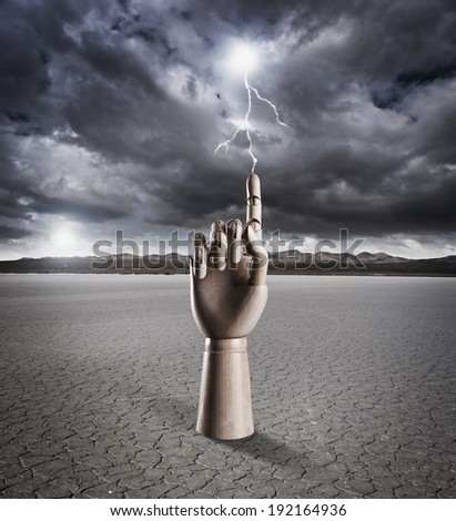 Manikin hand pointing with lightning