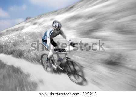 stock-photo-zoom-blur-effect-in-black-and-white-of-a-mountain-bike-racer-325215.jpg