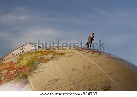 Business travel figure on globe