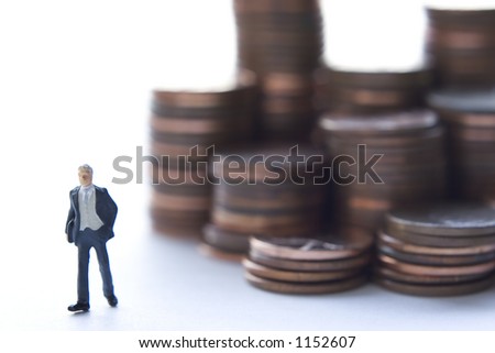 Business figures and stacks of coins