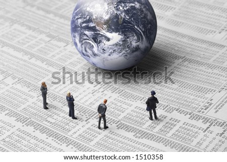 Business figures, earth and stock report