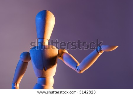 artist's mannequin posed as if gesturing