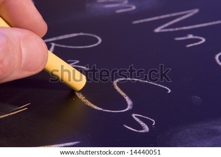Writing the alphabet on a chalk board