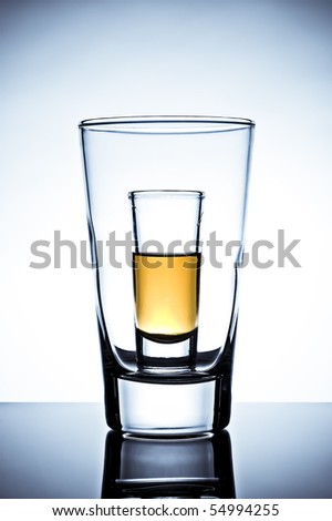 glass half full. stock photo : Shot glass half