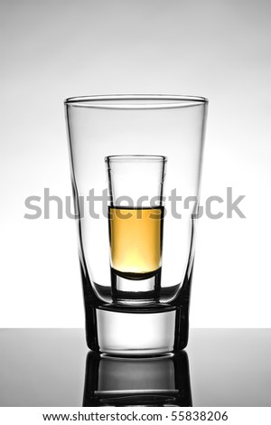 glass half full. stock photo : Shot glass half