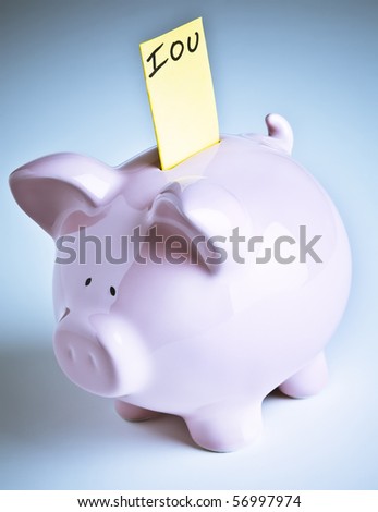 Piggy bank with IOU sticking out of its coin slot.