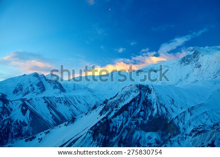 beautifull cloudy sunrise in the mountains with snow ridge. Annapurna region, Himalayas, Nepal.