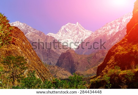Snow capped mountains. Walley of the mountain river. Himalaya, Nepal