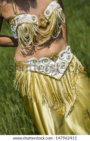 Traditional oriental cabaret belly dance costume, trimmed with glass bead fringe, rhinestones and sequence from Turkey.