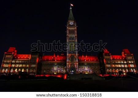 OTTAWA, CANADA AUGUST 5: The light show and narrative called Mosaika projected at night on the Canadian House of Parliament to celebrate the story of Canada on August 5, 2013 in Ottawa, Canada.