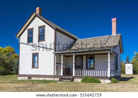 An old prairie farm house in summer