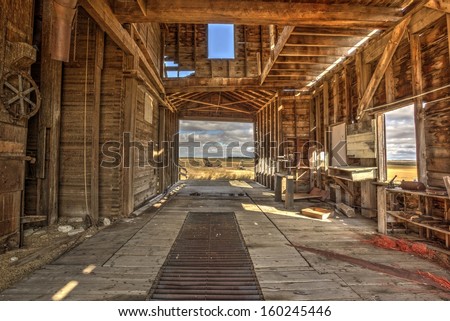 The interior of an old vintage wooden grain elevator. Processed using HDR.