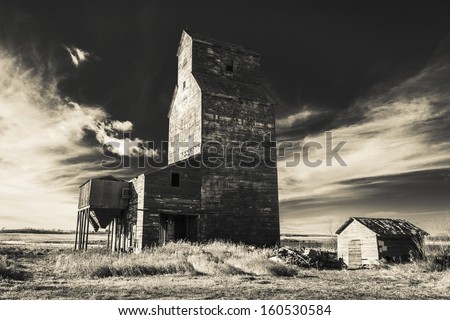 Grain elevators, which have been variously referred to as prairie icons, prairie cathedrals or prairie sentinels, are a visual symbol of western Canada. Processed with an infrared filter.
