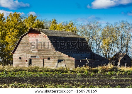 An old weathered vintage barn abandoned on the prairies