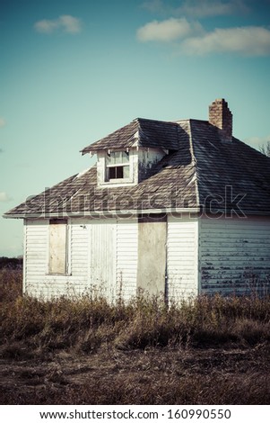 An old abandoned school house used in the early 1900's on the Canadian prairies.