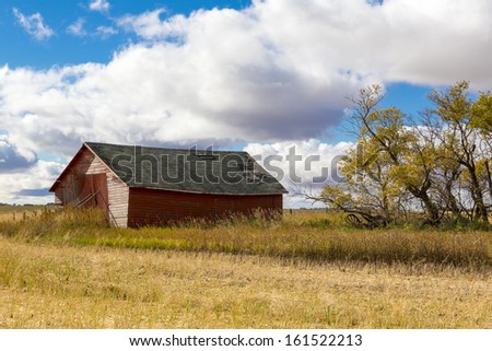 An old abandoned wood farm building