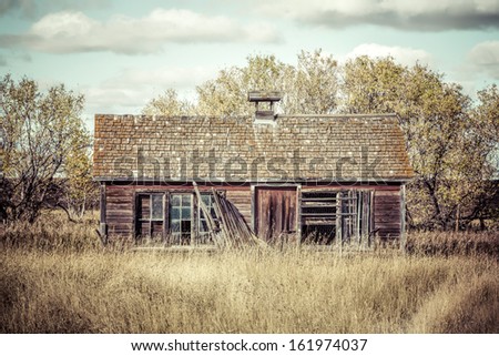 An old abandoned wood farm building