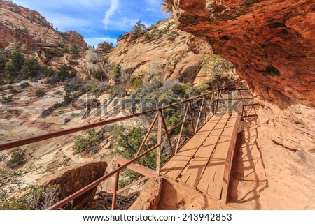 The Canyon Overlook Trail at Zion National Park takes you away from the road, through a natural cave carved out of the rock walls, and eventually offers an extraordinary view of Zion Canyon below.