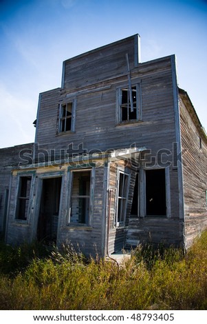Old rustic and vintage abandoned general store in a prairie ghost town