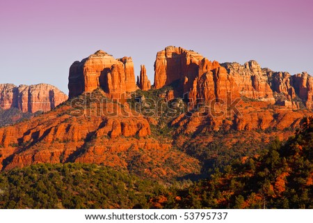 The view of Cathedral Rock in Sedona, Arizona.  The towering rock formations stand out like beacons in the dimmed landscape of the Red Rock State Park.
