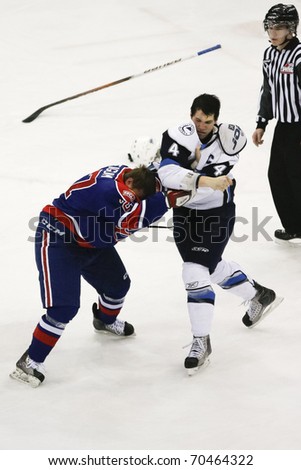 SASKATOON - FEB 2: Two players fighting in the Western Hockey League (WHL) game featuring the Regina Pats at the Saskatoon Blades. February 2, 2011 in Saskatoon, Canada.