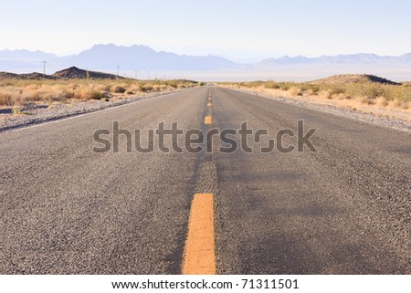 Deserted highway in the desert on a sunny day