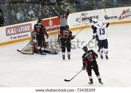 SASKATOON - MARCH 17: Curtis Hamilton (R) celebrates but the ref says no at a Western Hockey League game featuring the Moose Jaw Warriors at the Saskatoon Blades. March 17, 2011 in Saskatoon, Canada.