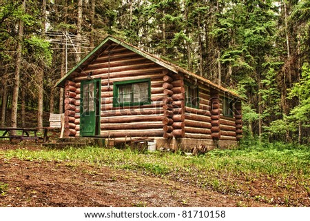 Log cabin surrounded by the forest at Duck Mountain Provincial Park in Saskatchewan, Canada