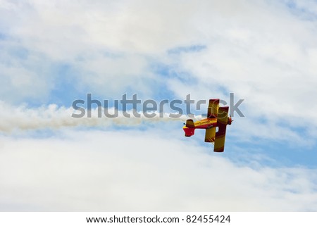 SASKATOON, CANADA - AUG 7:  Biplane performs at the annual International Festival of Heroes airshow in Saskatoon, Saskatchewan, Canada on August 7, 2011.