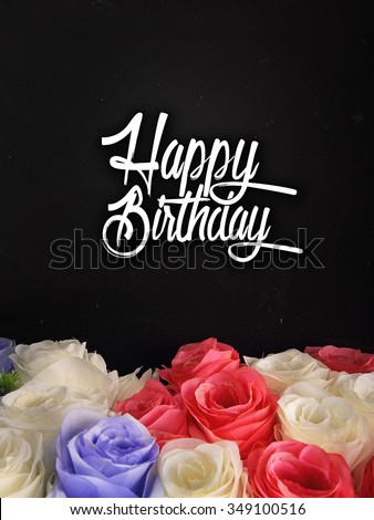 Birthday card design with handwritten typography and colorful roses on the bottom of composition