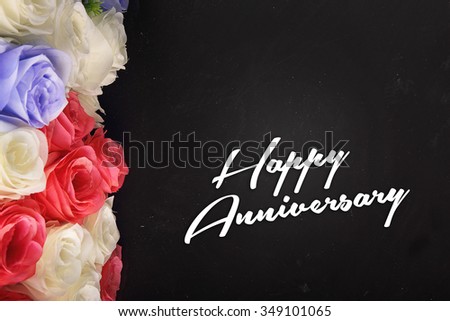 Happy anniversary typographic design with colorful floral decoration on the left border