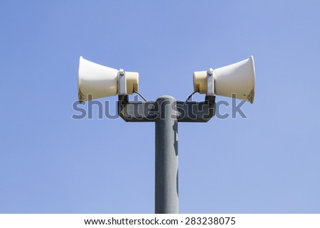 Speaker in public on blue sky