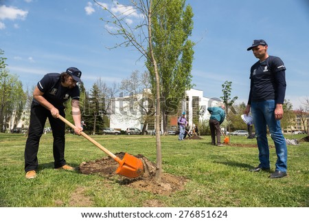 Union followers and workers are planting trees near the in the South park in Sofia, Bulgaria, April 27, 2015. The tree planting event is part of the International day for safe working environment.
