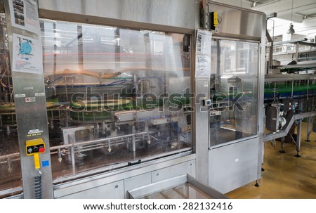 A filling machine with beer bottles in it is seen during production process in the  Molson Coors Kamenitza beer brewery, April 28, 2015, near the city of Haskovo, Bulgaria.