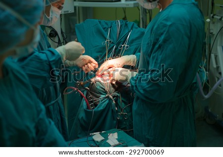 A team of neurosurgeons performing brain surgery to remove a tumor in the University hospital 