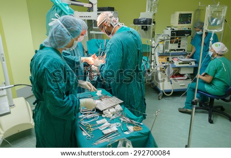 A team of neurosurgeons performing brain surgery to remove a tumor in the University hospital \