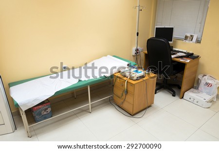 Medical cabinet with ECG. couch and medicaments is seen in the E.R clinic \