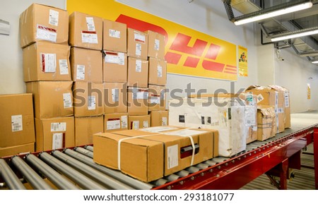 Package boxes of different sizes waiting to be distributed and delivered are seen on a conveyor belt in the DHL storehouse in Sofia, Bulgaria, October 7, 2014.