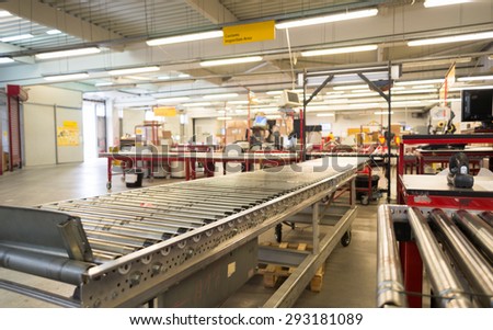 Package conveyor belt for distributing packages for delivery is seen in foreground in the DHL warehouse in Sofia, Bulgaria, October 7, 2014.