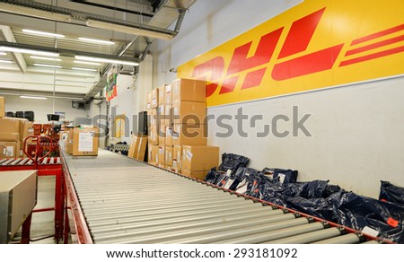 Package boxes of different sizes waiting to be delivered are seen next to conveyor belt in the DHL storehouse in Sofia, Bulgaria, October 7, 2014.