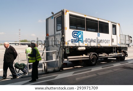 Passengers are getting off of an airport passenger mobility assistance vehicle, also known as PRM, at Sofia airport, Sofia, Bulgaria, April 22, 2014.