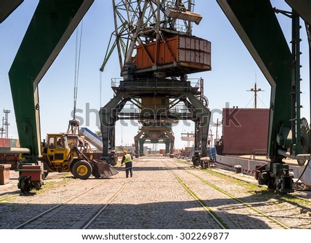 Giant port cranes during operations for loading and unloading ships with cargo at Varna port, Varna, Bulgaria, May 16, 2014.