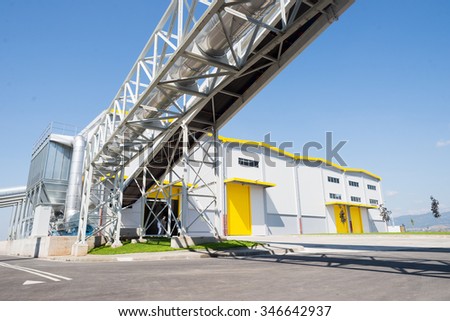 Sofia, Bulgaria, September 14, 2015 - Waste processing silos and pipelines installation for processing recycled waste material and bio gas in a recycling waste to energy factory.